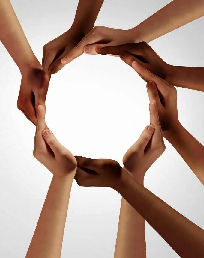 multi-ethnic hands forming a circle